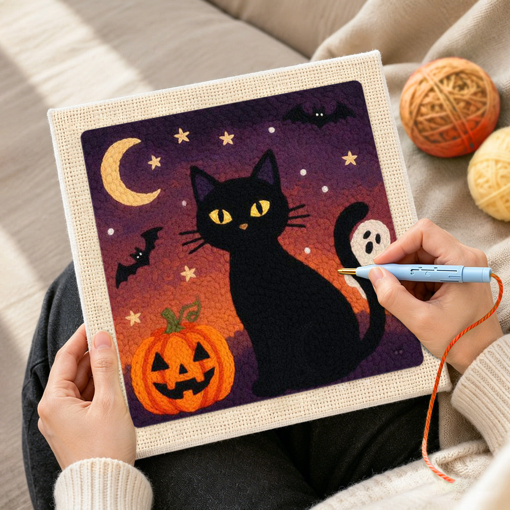 Creating handmade halloween black cat night punch needle artwork