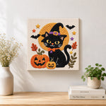 Finished halloween black cat artwork displayed on a wall
