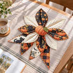 Halloween black cat handmade quilted bow displayed on a table as seasonal home decor