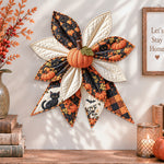 Halloween black cat quilted bow displayed as handmade wall decor in a cozy home