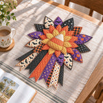 Halloween candy corn handmade quilted bow displayed on a table as seasonal home decor