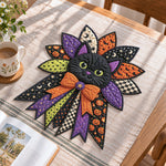 Halloween cat night handmade quilted bow displayed on a table as seasonal home decor