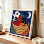 Halloween fruit basket scene punch needle artwork displayed on a table