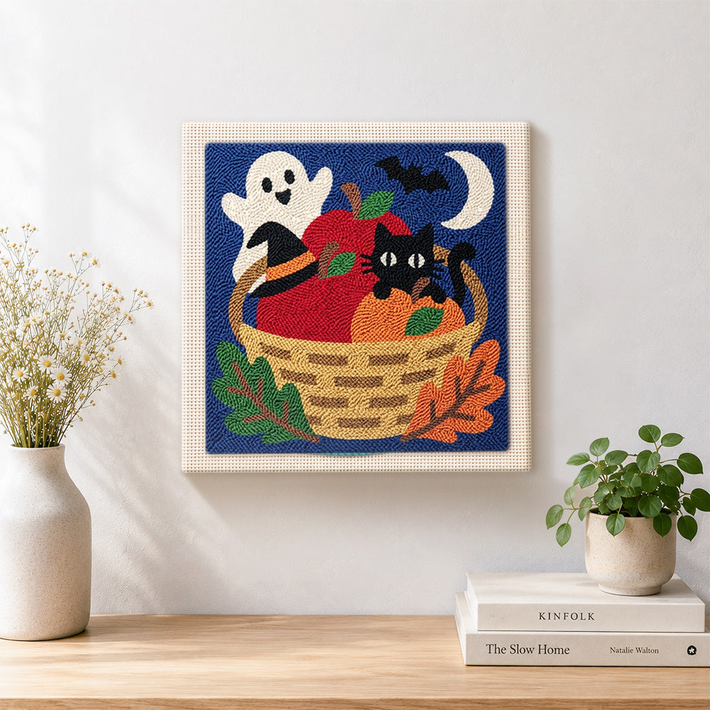 Finished halloween fruit basket scene artwork displayed on a wall