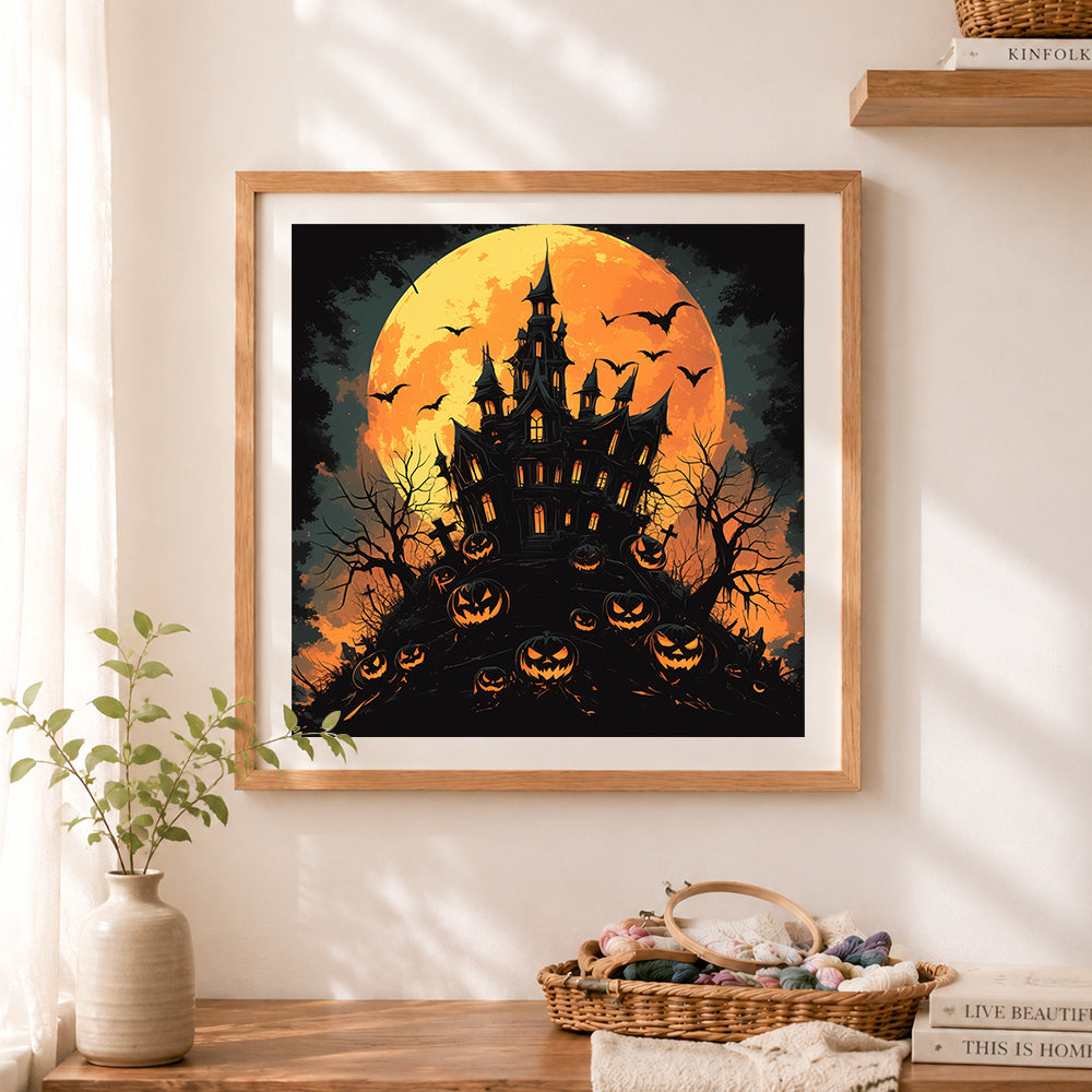 Finished halloween haunted castle cross stitch artwork displayed as home decor