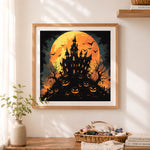 Finished halloween haunted castle cross stitch artwork displayed as home decor
