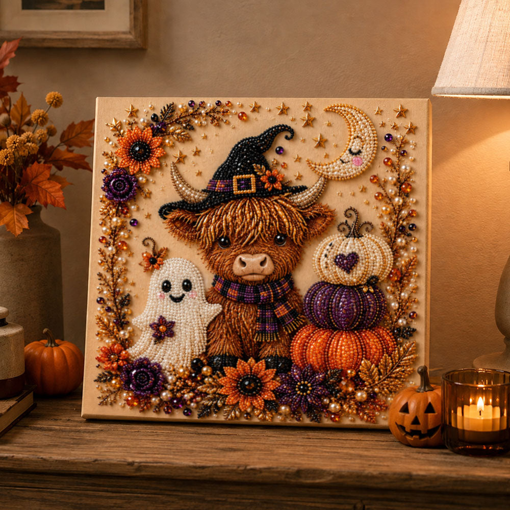 Finished halloween highland cow and ghost pearl diamond painting artwork displayed as holiday home decor