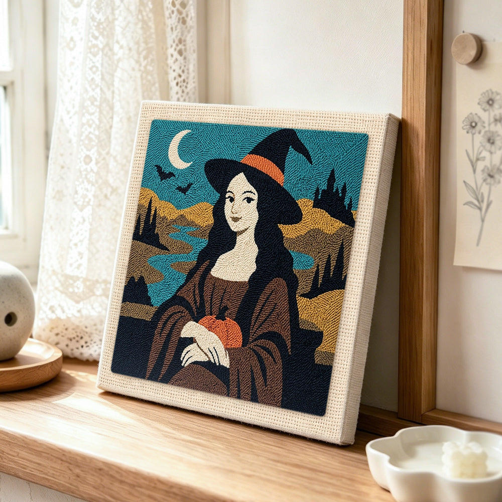 Halloween mona lisa witch punch needle artwork displayed on a table
