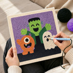 Creating handmade halloween monster trio punch needle artwork