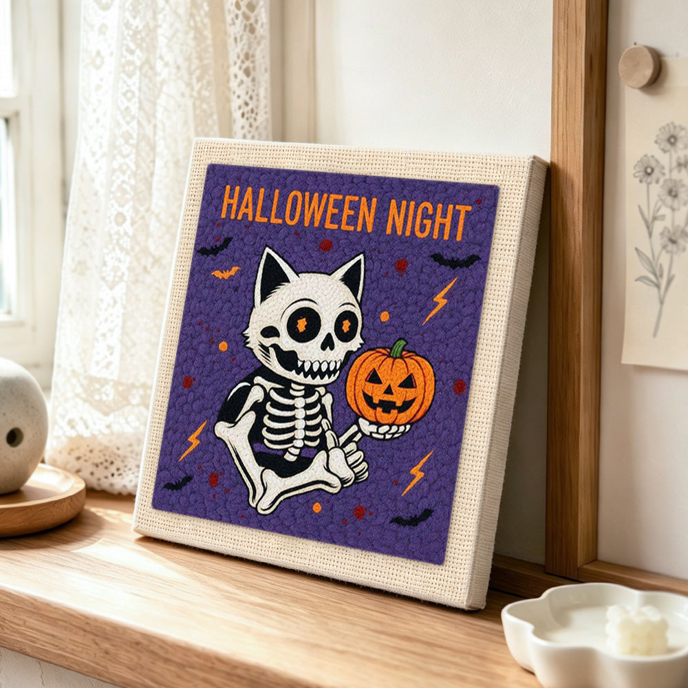 Halloween night skeleton cat punch needle artwork displayed on a table