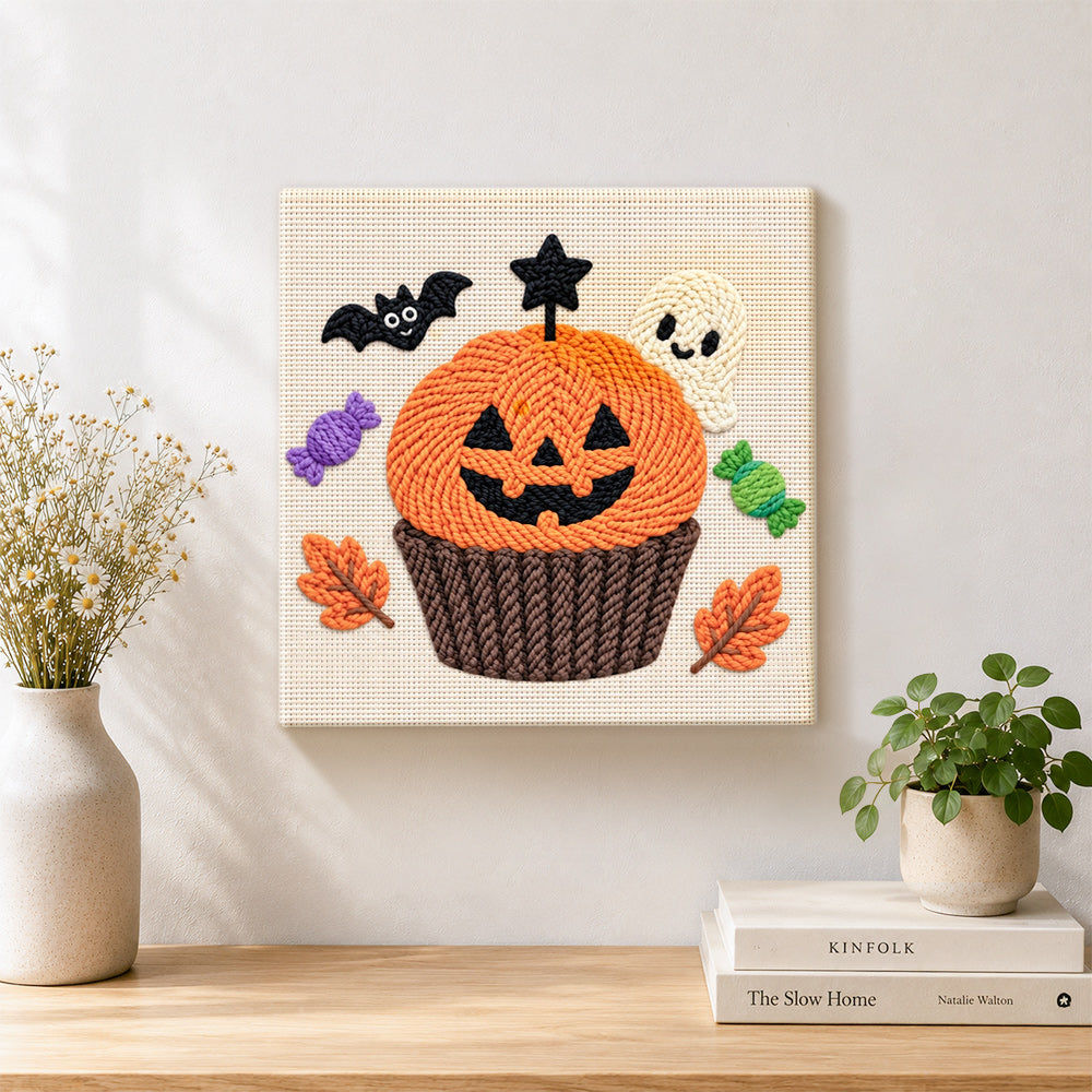 Finished halloween pumpkin cupcake artwork displayed on a wall