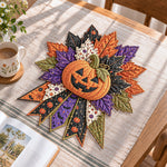 Halloween pumpkin handmade quilted bow displayed on a table as seasonal home decor