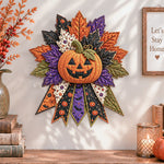 Halloween pumpkin quilted bow displayed as handmade wall decor in a cozy home