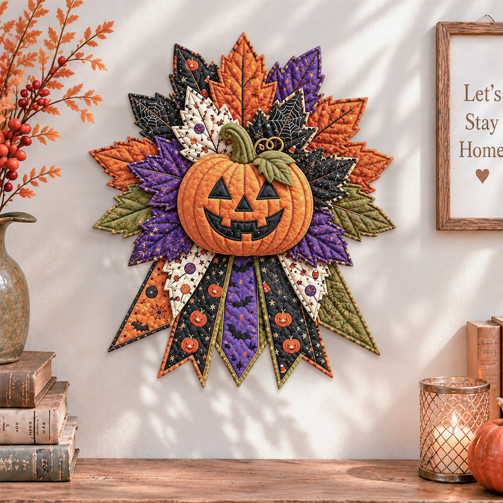 Halloween pumpkin quilted bow displayed as handmade wall decor in a cozy home