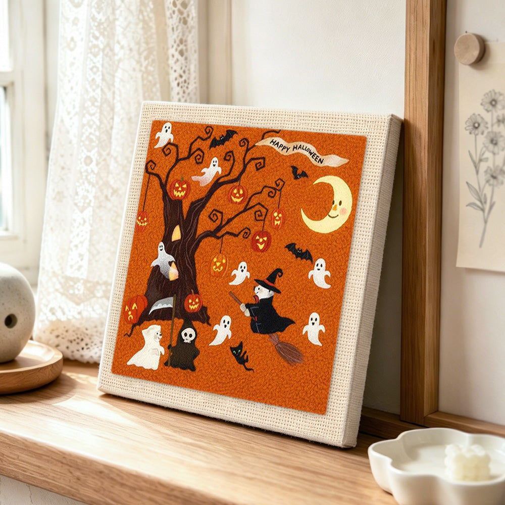 Halloween spooky tree punch needle artwork displayed on a table