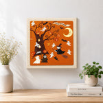 Finished halloween spooky tree artwork displayed on a wall