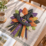 Halloween witch hat handmade quilted bow displayed on a table as seasonal home decor