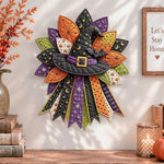 Halloween witch hat quilted bow displayed as handmade wall decor in a cozy home