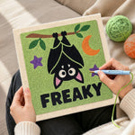 Creating handmade hanging freaky bat punch needle artwork