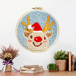 Finished happy christmas reindeer artwork displayed on a wall