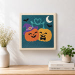Finished happy couple pumpkins artwork displayed on a wall