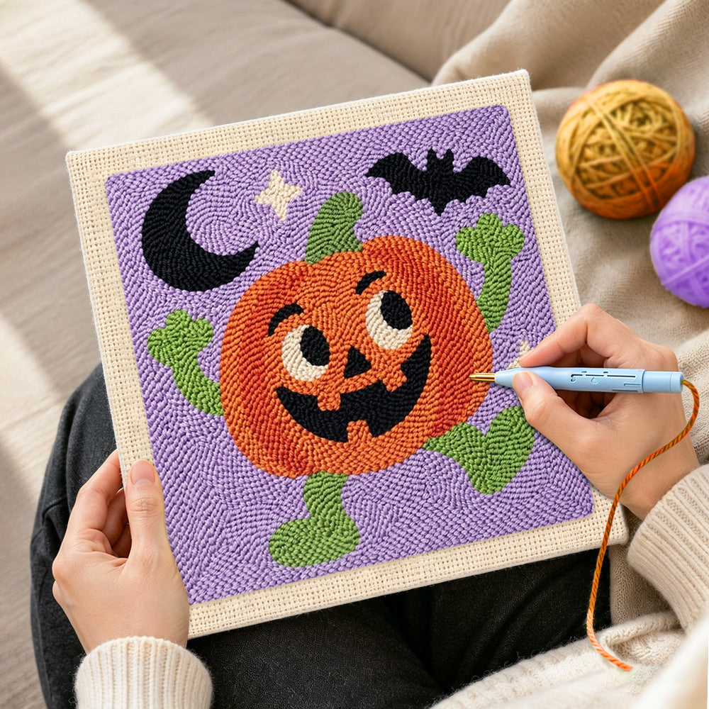 Creating handmade happy dancing pumpkin character punch needle artwork