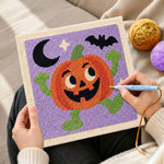 Creating handmade happy dancing pumpkin character punch needle artwork