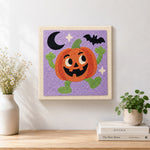 Finished happy dancing pumpkin character artwork displayed on a wall