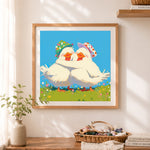 Finished happy duck couple cross stitch artwork displayed as home decor