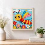 Finished happy flying bee in a flower garden artwork displayed on a wall