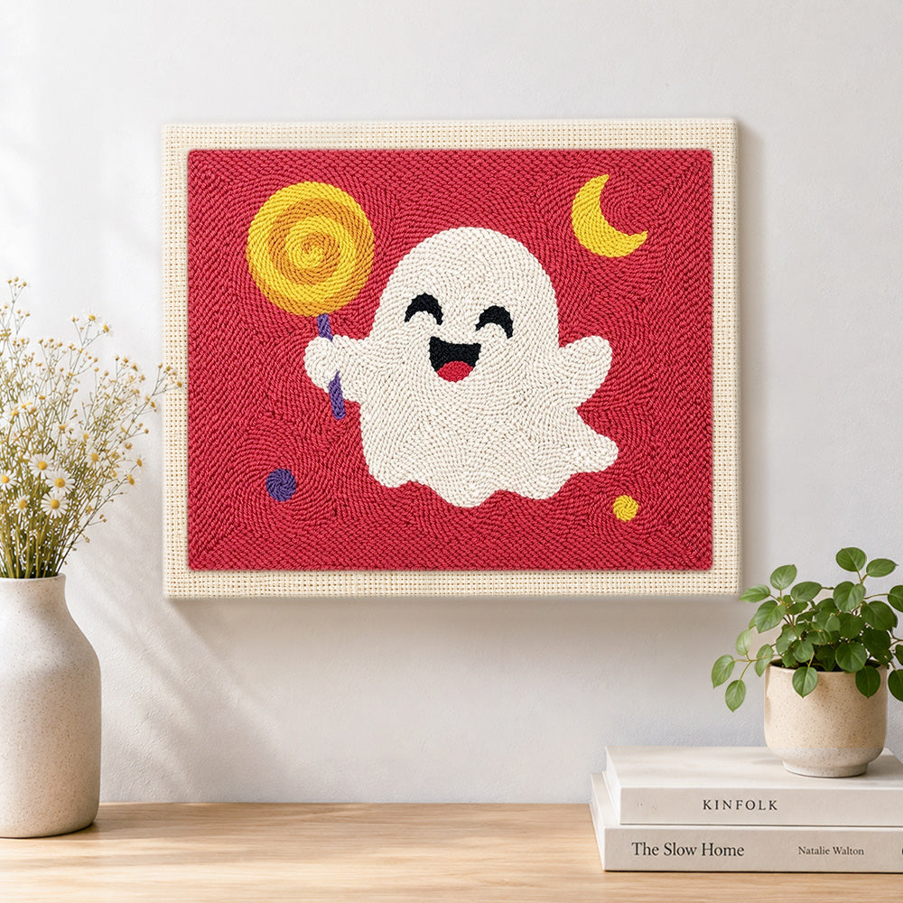 Finished happy ghost with lollipop artwork displayed on a wall