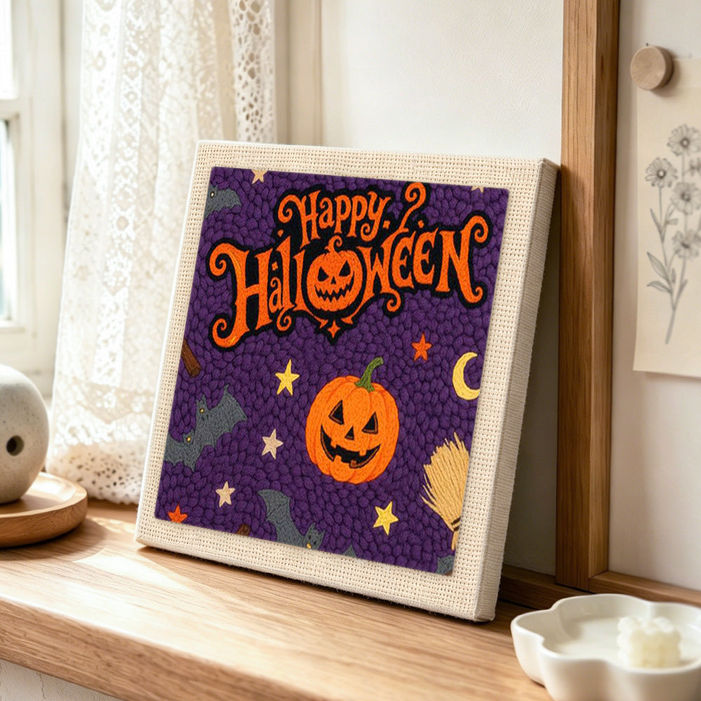 Happy halloween greeting punch needle artwork displayed on a table