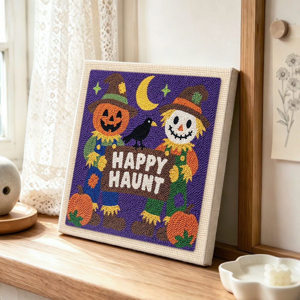 Happy haunt scarecrow pair punch needle artwork displayed on a table