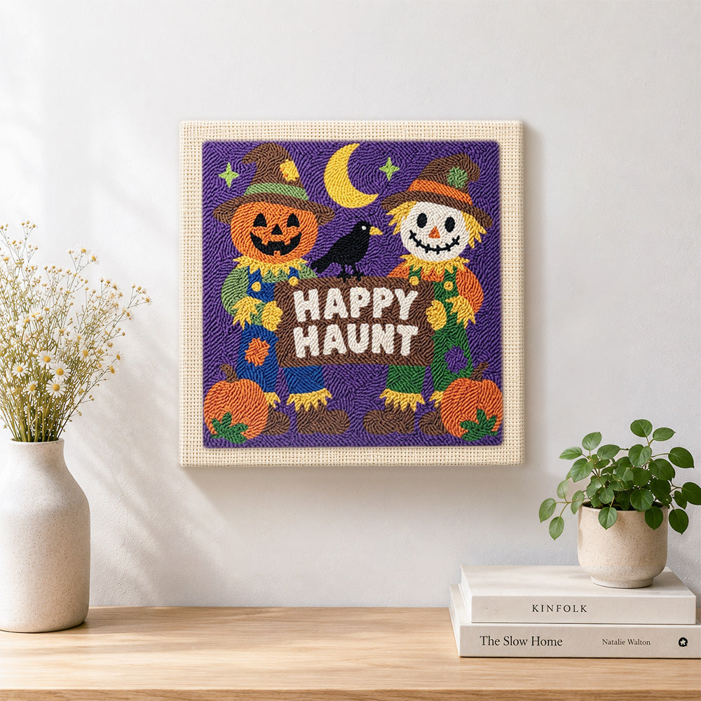 Finished happy haunt scarecrow pair artwork displayed on a wall