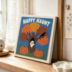 Happy haunt tree punch needle artwork displayed on a table