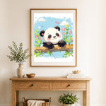 Finished happy panda on branch cross stitch artwork displayed as home decor