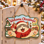 Happy santa cat in snow town paint by numbers door hanger on a garden gate
