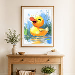 Finished happy yellow duckling cross stitch artwork displayed as home decor