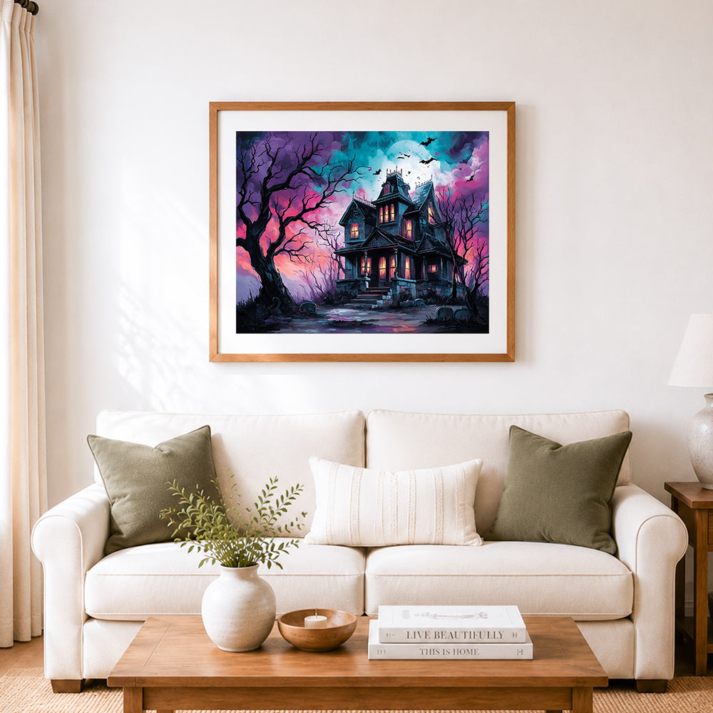 Finished haunted halloween mansion cross stitch artwork displayed as home decor
