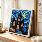 Haunted house night scene punch needle artwork displayed on a table