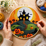 Creating the Haunted house on hill with pumpkins wool painting by hand with a felting needle