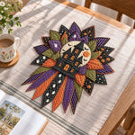 Haunted house handmade quilted bow displayed on a table as seasonal home decor