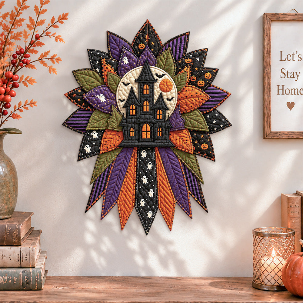 Haunted house quilted bow displayed as handmade wall decor in a cozy home