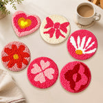 Heart, flower, and four-leaf clover punch needle coasters used for home decoration