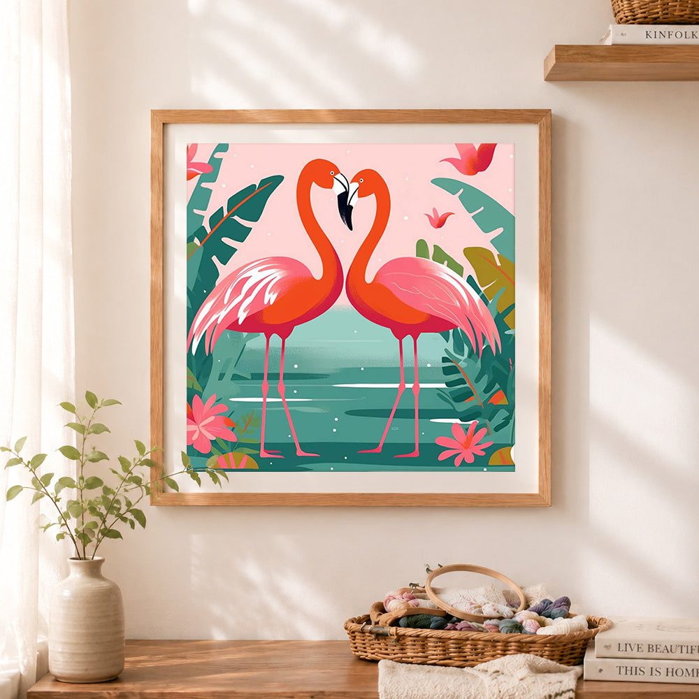 Finished heart‑shaped flamingo couple cross stitch artwork displayed as home decor
