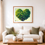 Finished heart‑shaped green canopy cross stitch artwork displayed as home decor