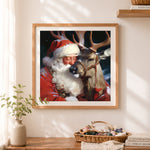 Finished heartwarming santa hugging reindeer cross stitch artwork displayed as home decor