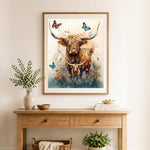 Finished highland cattle and butterflies cross stitch artwork displayed as home decor