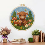 Finished highland cow and mushrooms in spring artwork displayed on a wall