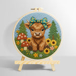 Highland cow and mushrooms on the green grass punch needle kit for beginners